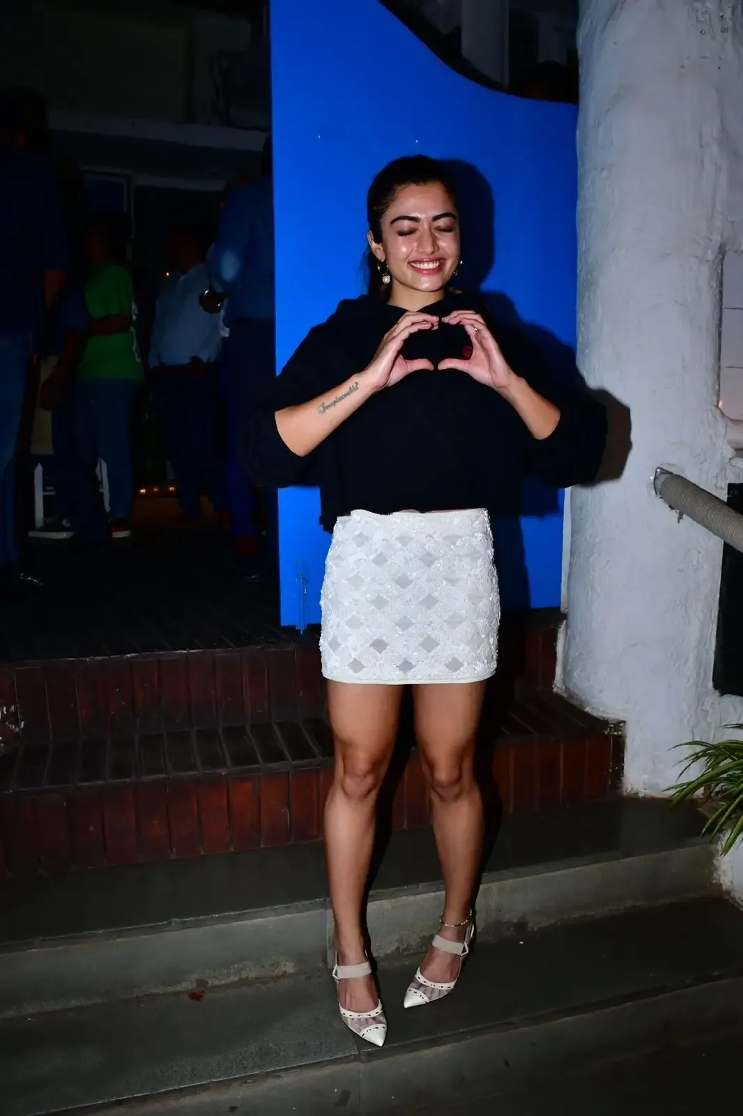 RASHMIKA MANDANNA LONG LEGS SHOW IN MINI WHITE SKIRT 5